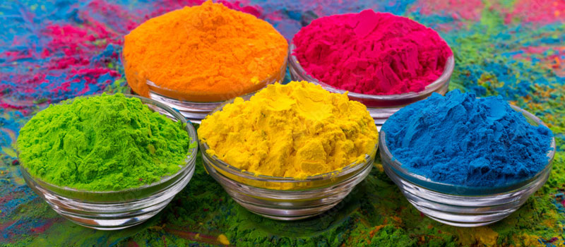 Pastel bowls of colourful gulal powder arranged for Holi celebration